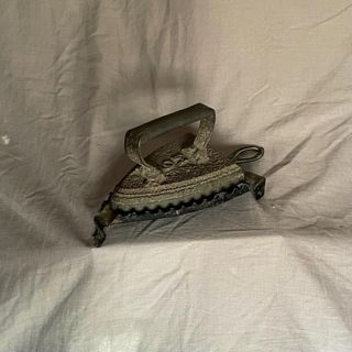 Plancha antigua de hierro fundido