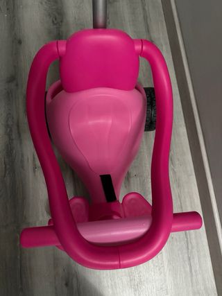 Triciclo infantil rosa con empujador