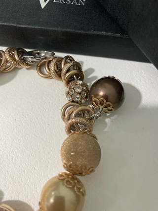 Pulsera Paul Versan dorada con charms