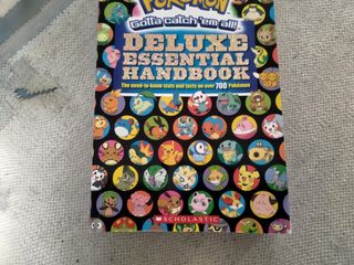 Pokémon Deluxe Essential Handbook Livro, Como Novo