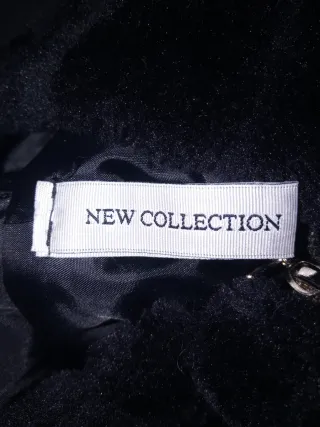 Bomber de pelo negra con capucha