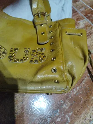 Bolso Tous amarillo con tachuelas
