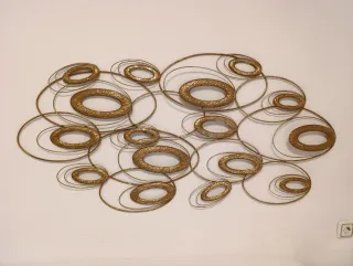 Decoración pared metal dorado óvalos