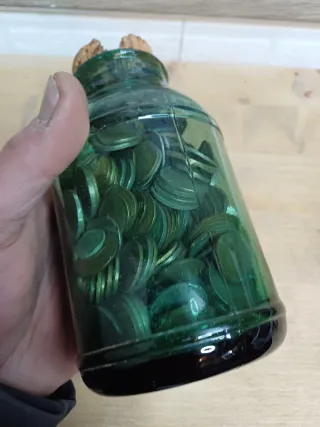 Monedas antiguas en tarro de cristal