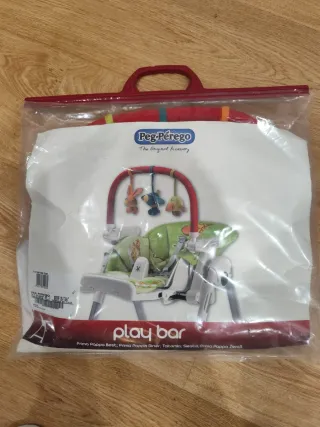 Trona Peg Perego con barra de juegos