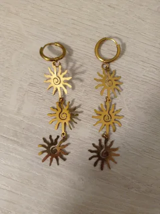 Pendientes largos sol dorados