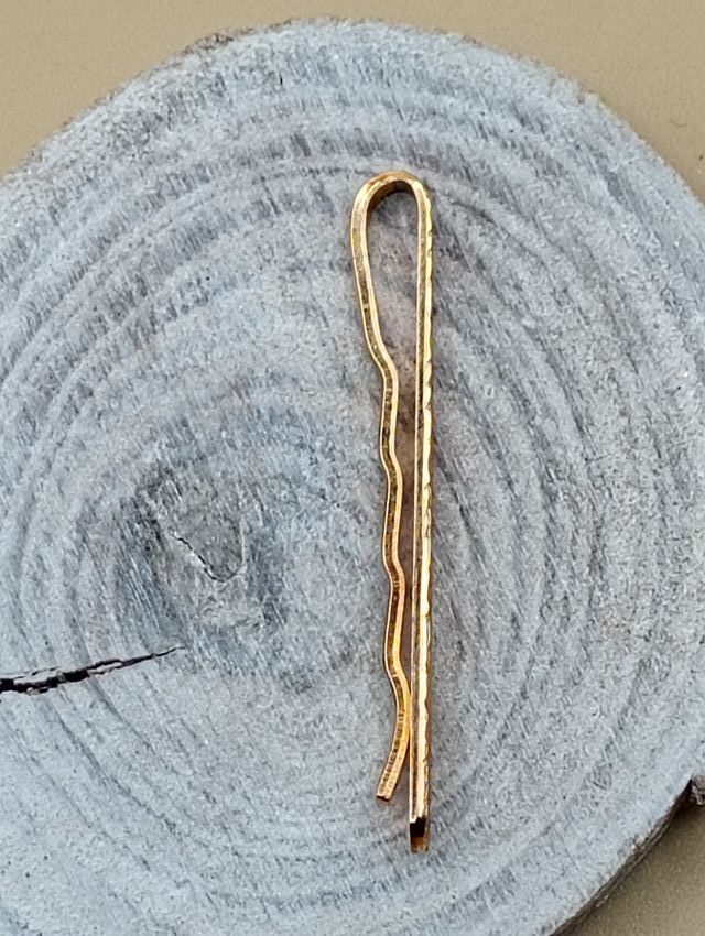 Pasador de corbata dorado