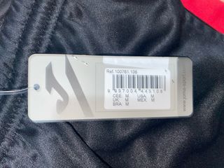 Pantalón de chándal Joma negro y rojo