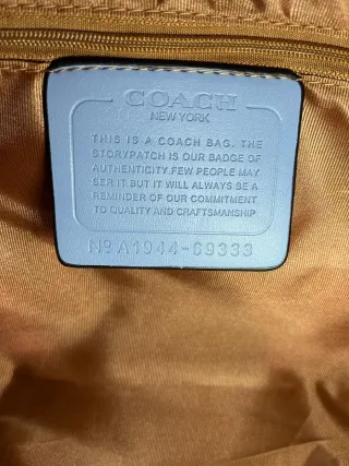 Bolso Coach con estampado de cerezas