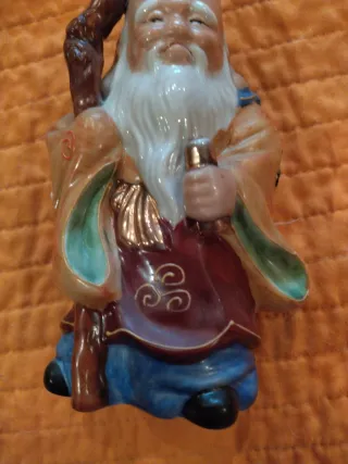 Figura oriental antigua bastón