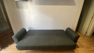 Sofá cama gris de tela