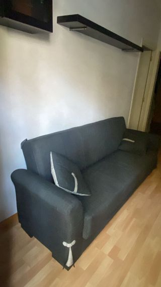 Sofá cama gris de tela
