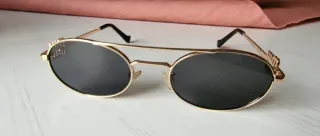 Gafas de sol MIU doradas y grises