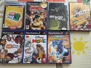 PlayStation 2 con 15 juegos, 4 mandos y 2 micros