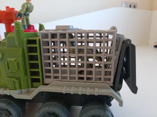 Camión Caza Dinosaurios con Figura