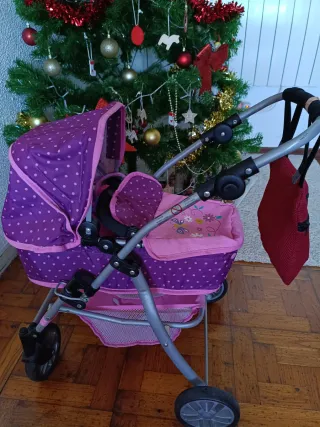Carrito de muñecas rosa y morado