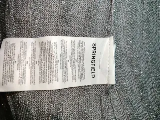 Blusa plateada brillante con lazo