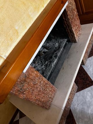 Chimenea de leña de mármol y piedra