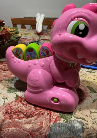 Dentina dinosauro rosa giocattolo