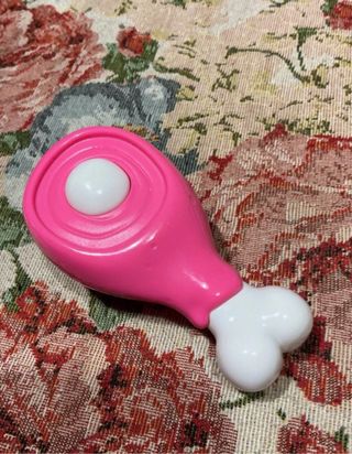 Dentina dinosauro rosa giocattolo