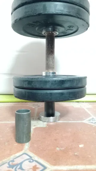 Mancuernas y discos de goma gimnasio