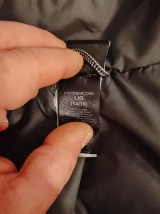 The North Face piumino nero con zip gialla