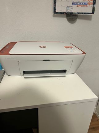 Impresora HP blanca y naranja