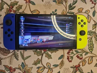 Nintendo Switch OLED en su caja original