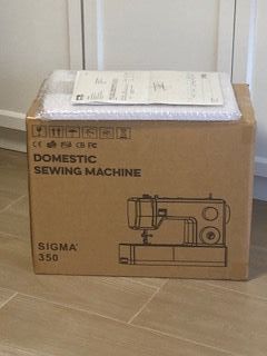 Máquina de coser Sigma 350 y mesa nuevas.