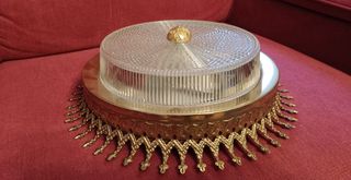 Lámpara de techo dorada y transparente