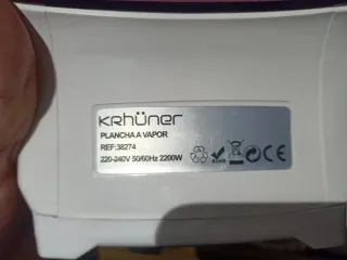 Plancha de vapor rosa y blanca