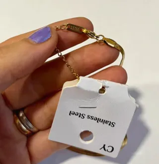 Collana con fiore in acciaio dorato