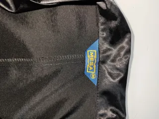 Conjunto chaqueta y falda satén negro