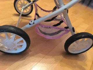 Cochecito de muñecas rosa