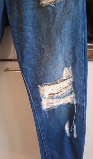 Jeans uomo strappati taglia 48