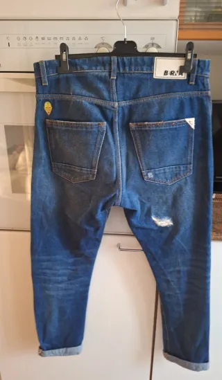 Jeans uomo strappati taglia 48