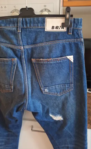 Jeans uomo strappati taglia 48