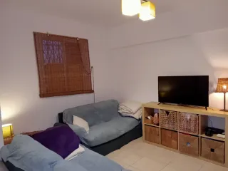 Casa adosada, tipo dúplex.