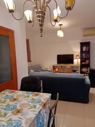 Casa adosada, tipo dúplex.