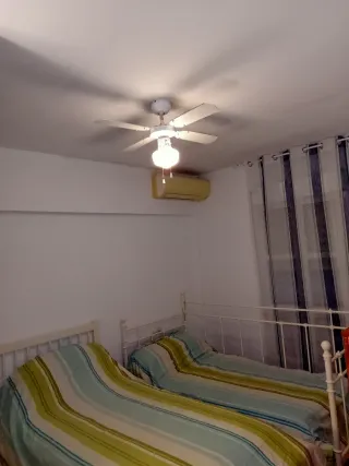 Casa adosada, tipo dúplex.