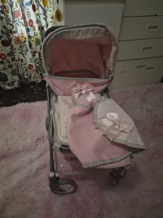 Carrito de paseo para muñecas rosa