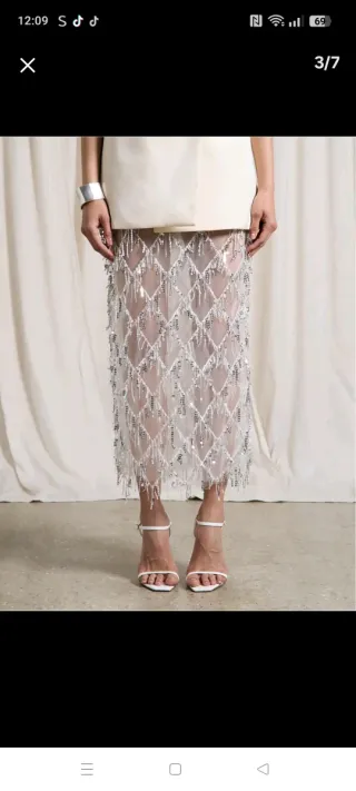 Nueva Falda blanca talla S con lentejuelas