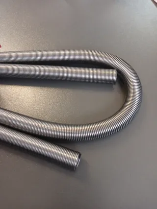 Muelles dobladores de tubo