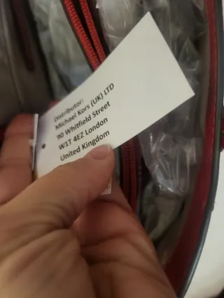 Mala Michael Kors Voyager vermelho framboesa