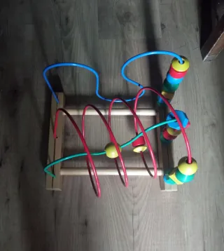 Triciclo infantil azul con barra de empuje