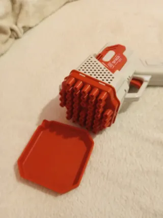 Pistola de burbujas roja