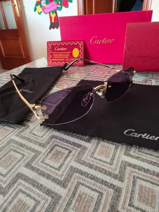 Gafas de sol Cartier doradas y negras