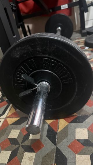 Banco de pesas multifunción mas discos mas barras