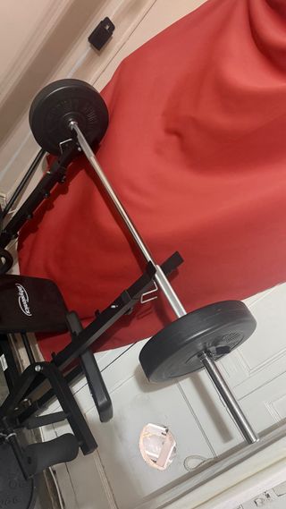 Banco de pesas multifunción mas discos mas barras