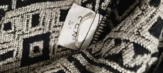 Falda mini étnica Stradivarius con flecos